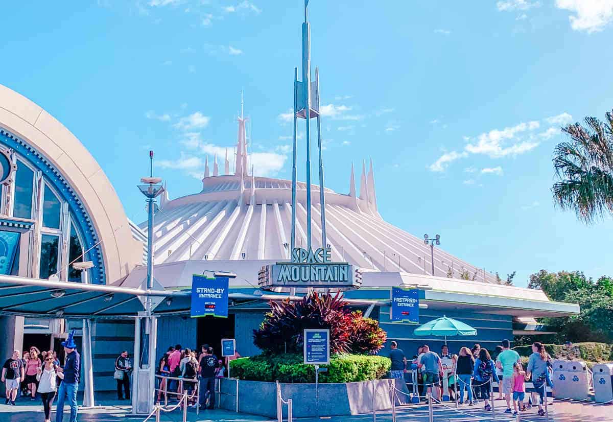Large round white building with a sign out front that says Space Mountain